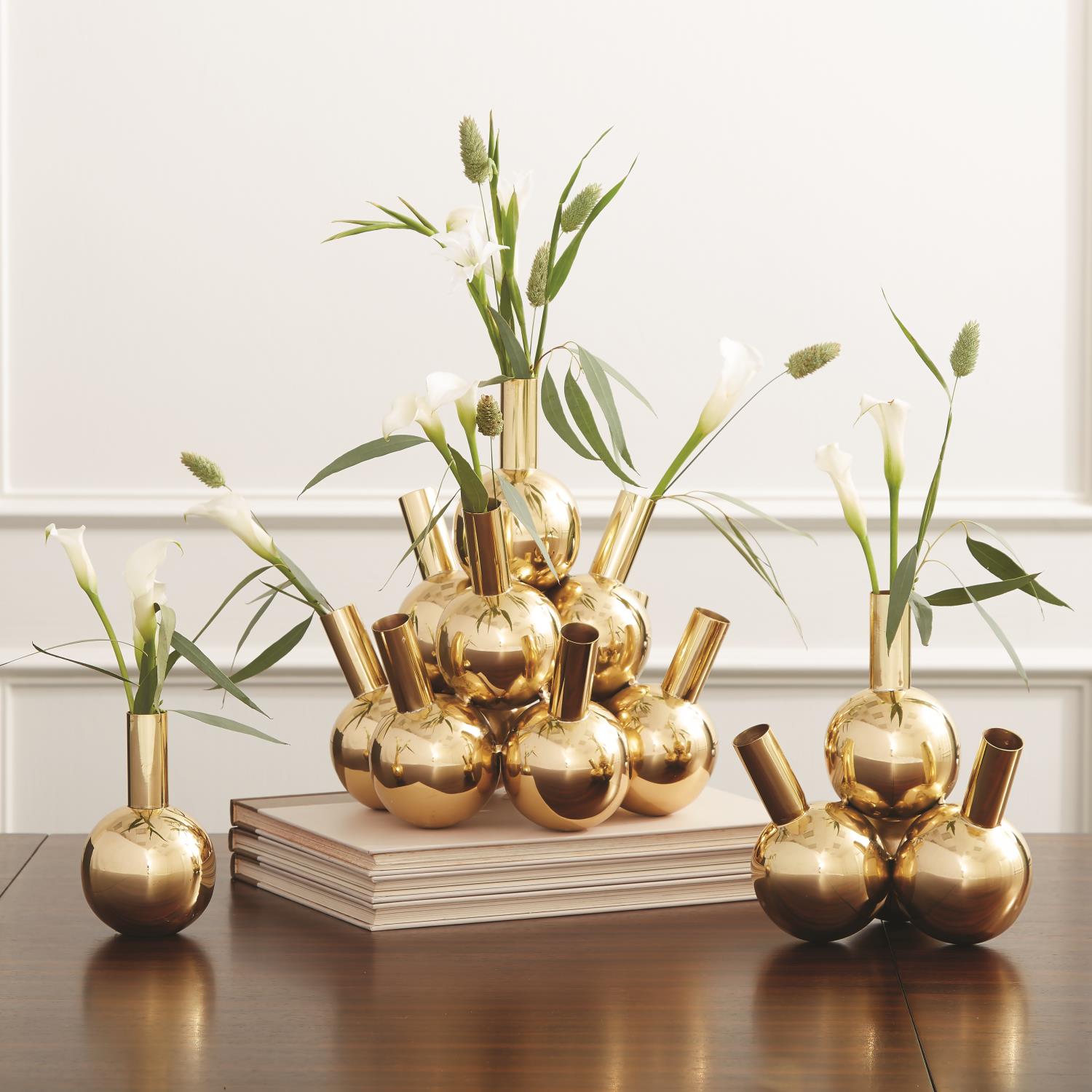 TEN BOTTLE BRASS VASE